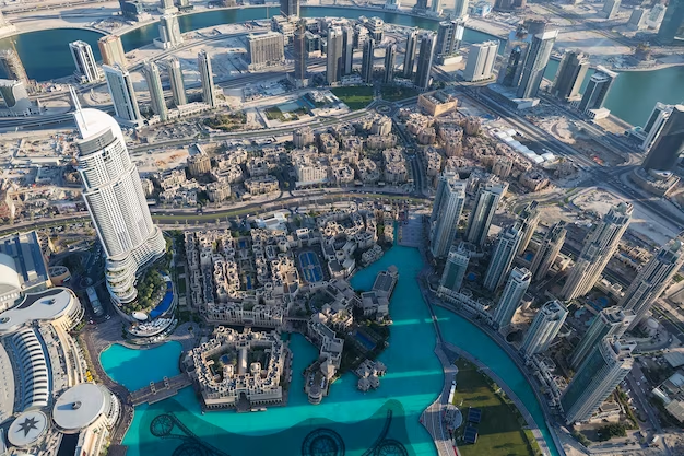 Aerial view of modern skyscrapers and luxury residential buildings in Dubai, showcasing the city's thriving real estate market.