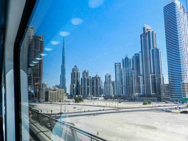 View of Dubai skyscrapers from a window, showcasing urban landscape relevant to studio flats in Al Rashidiya.