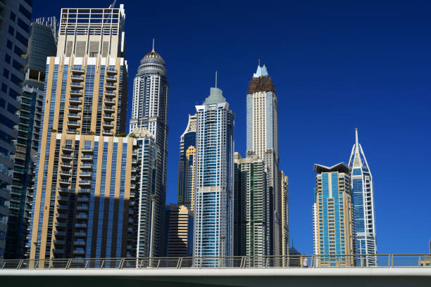 Modern high-rise buildings in Dubai against a clear blue sky, representing luxury real estate in Burj Khalifa.