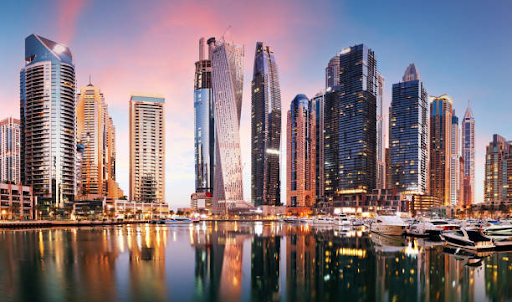 Skyscrapers and yachts reflecting in a waterfront, showcasing modern urban architecture at Damac Hills 2.